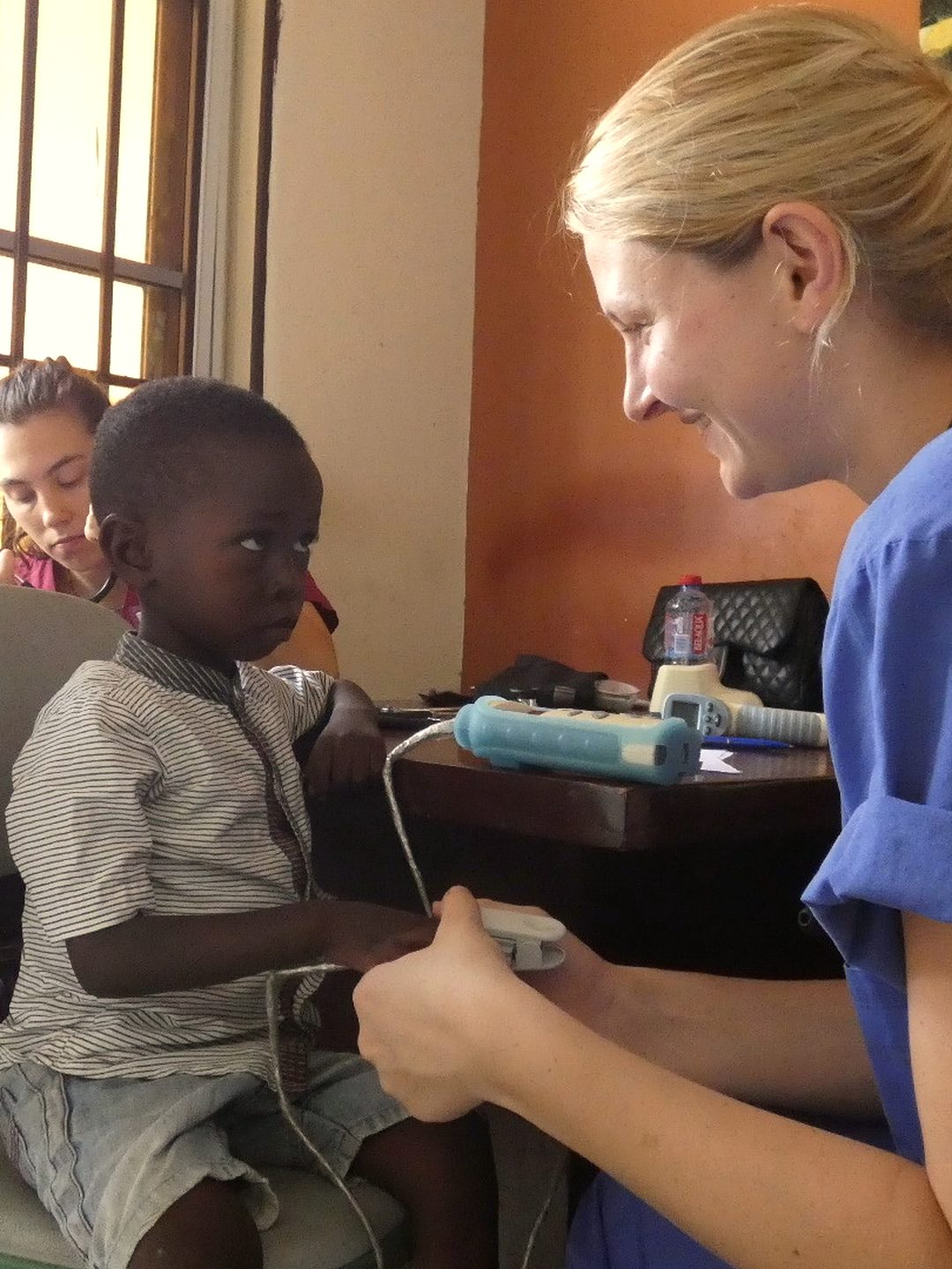 Students observing a ward round alongside resident doctors in Cape Coast